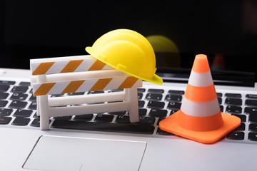 Road Barrier With Hard Hat And Traffic Cone
