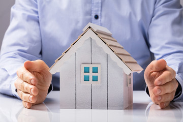 Human Hand Protecting House Model