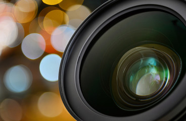 Closeup of camera lens on blur bokeh background