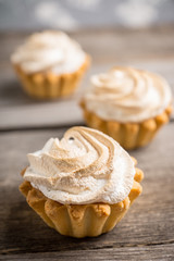 Creamy cake on the rustic background. Selective focus.