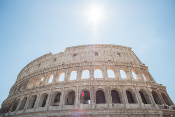 Naklejka premium The Colosseum, an oval amphitheatre in the center of the city of Rome, Italy. It is the famous landmark built of concrete and sand.
