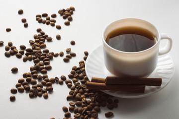 White Cup with Coffee, Coffee Beans on a White Background