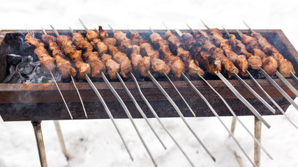Shish kebab fry on the grill in winter