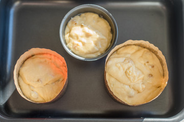 Forms for baking with a raw dough on a baking sheet - natural light