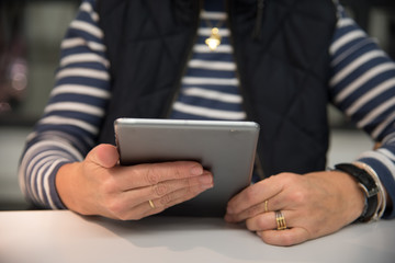 Close up of woman reading a tablet