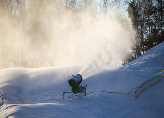 Fototapeta na wymiar Snow cannon in a ski resort in winter