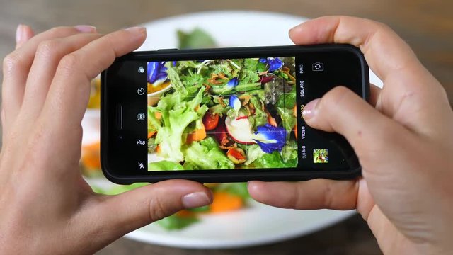 Food Photography And Blogging Concept. Hands Photographing Salad With Phone.