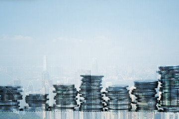 Fototapeta premium Double exposure Stack of coin with financial graph over city and office building background, business and financial concept.