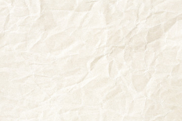 Crumpled pale yellow paper texture