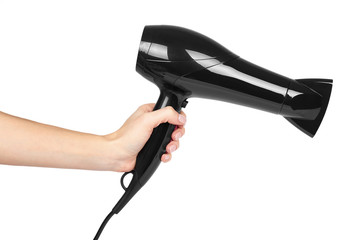 Black plastick hair dryer with pink buttons in hand. Isolated on white background. Home appliance,...