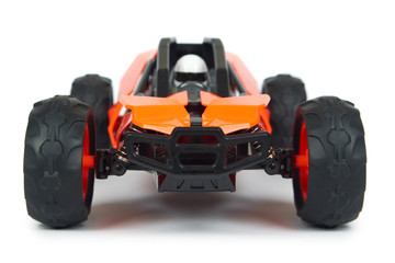 RC model rally, off road buggy with remote control in hand. Isolated on white background, joy and fun sport