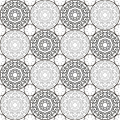 A pattern of circles in contrasting colors. Black and white seamless geometric pattern