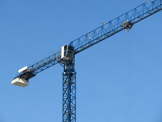 Naklejka premium Construction crane on background of blue sky