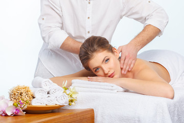 Beautiful, young and healthy woman in spa salon. Massage treatment