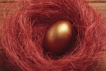 gold eggs on wooden table