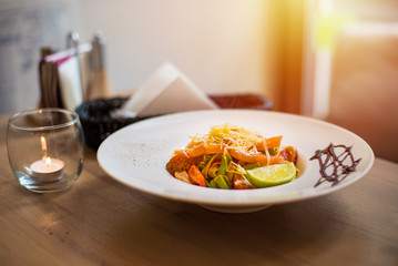 Italian pasta with salomon served on the plate