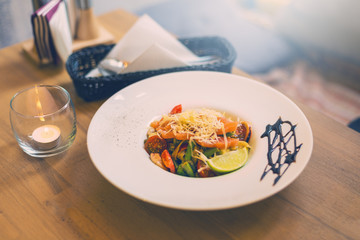 Italian pasta with salomon served on the plate