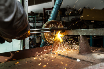 the worker cutting steel.
