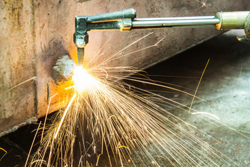 the worker cutting steel