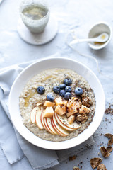 morning oat porridge with fresh fruits and tea