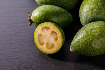 fresh fruits of the feijoa on the rustic background