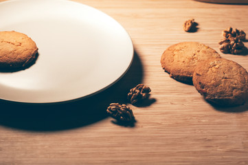 round sweet cookies with candied fruit and walnuts