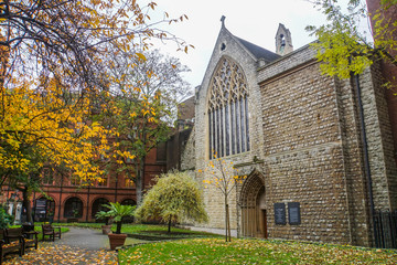 ancient church in public garden in autumn in London