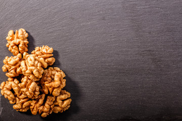 Walnut on a dark rustic wooden background