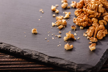 Walnut on a dark rustic wooden background