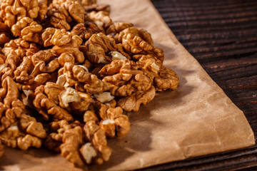 Walnut on a dark rustic wooden background