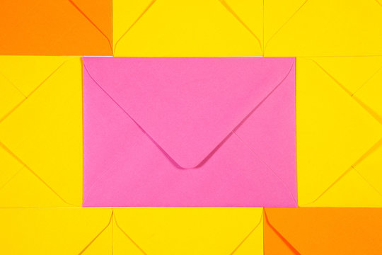 Pattern from orange, yellow and pink  envelopes