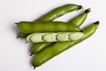 fresh broad beans on a white background