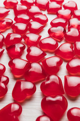 background of red hearts on a white wooden substrate