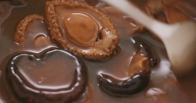 Chinese style cuisine, abalone and mushroom on lettuce