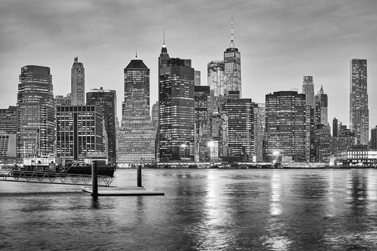 Black and white New York City skyline at night, USA.