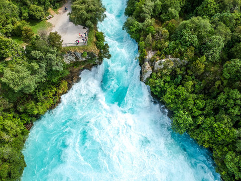 Fototapeta Stunning aerial wide angle drone view of Huka Falls waterfall in Wairakei near Lake Taupo in New Zealand. The waterfall is part of the Waikato River and is a major tourist attraction.
