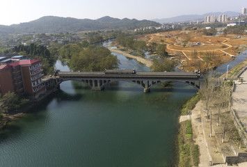 Green river under ancient Chinese bridge