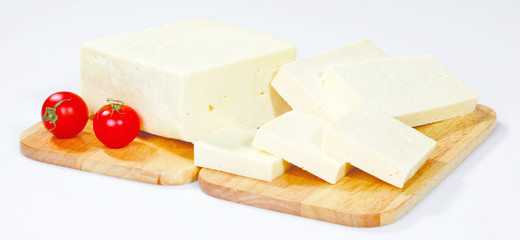 cheese on wooden board isolated on white