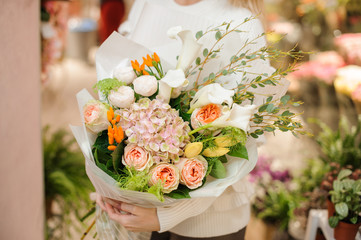 Amazing multicolored valentine bouquet of flowers in female hands