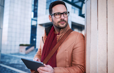Fototapeta premium Business man using digital tablet outdoor. Business, education, lifestyle concept