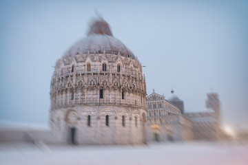 Baptistery of Pisa after a winter snowfall. Square of Miracles at dawn