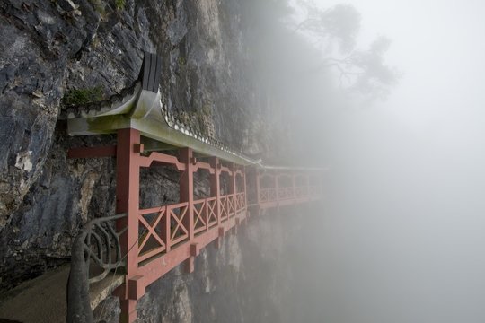 Covered hiking trail on a cliff in fog, Tianmen Mountain, Tianmen Mountain National Park, Yongding, Zhangjiajie, China, Asia