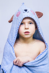 The boy in the towel, after the bath.