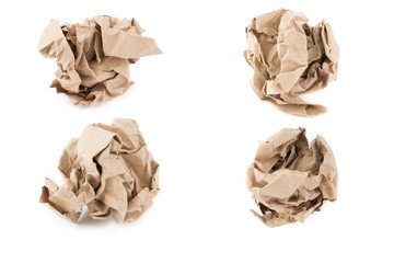 Crumpled brown paper ball on white background.