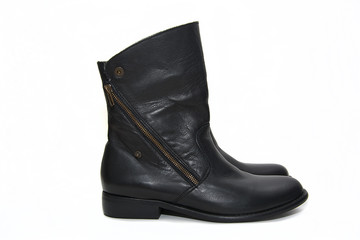 Black female leather boots isolated on white background.