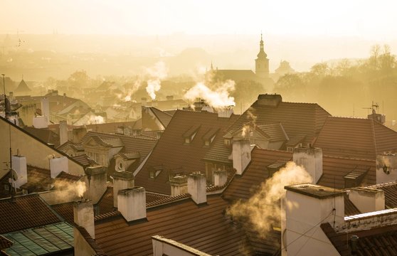 Morning atmosphere, roofs with smoking chimneys in fog, sunrise, historic centre, Prague, Bohemia, Czech Republic, Europe