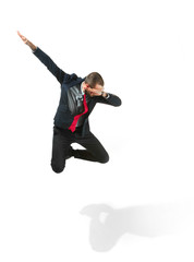 Fototapeta premium Funny cheerful businessman jumping in air over white background