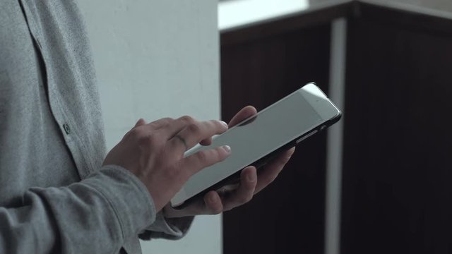 close - up - hands businessman using a digital tablet for his job