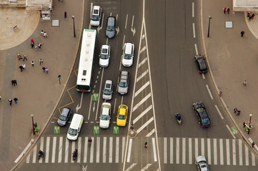 aerial view of cars and people, busy traffic in big intersection. Paris