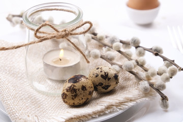Easter laying table appointments, table setting options. Tableware items with festive decoration and flowers. Happy easter holiday.